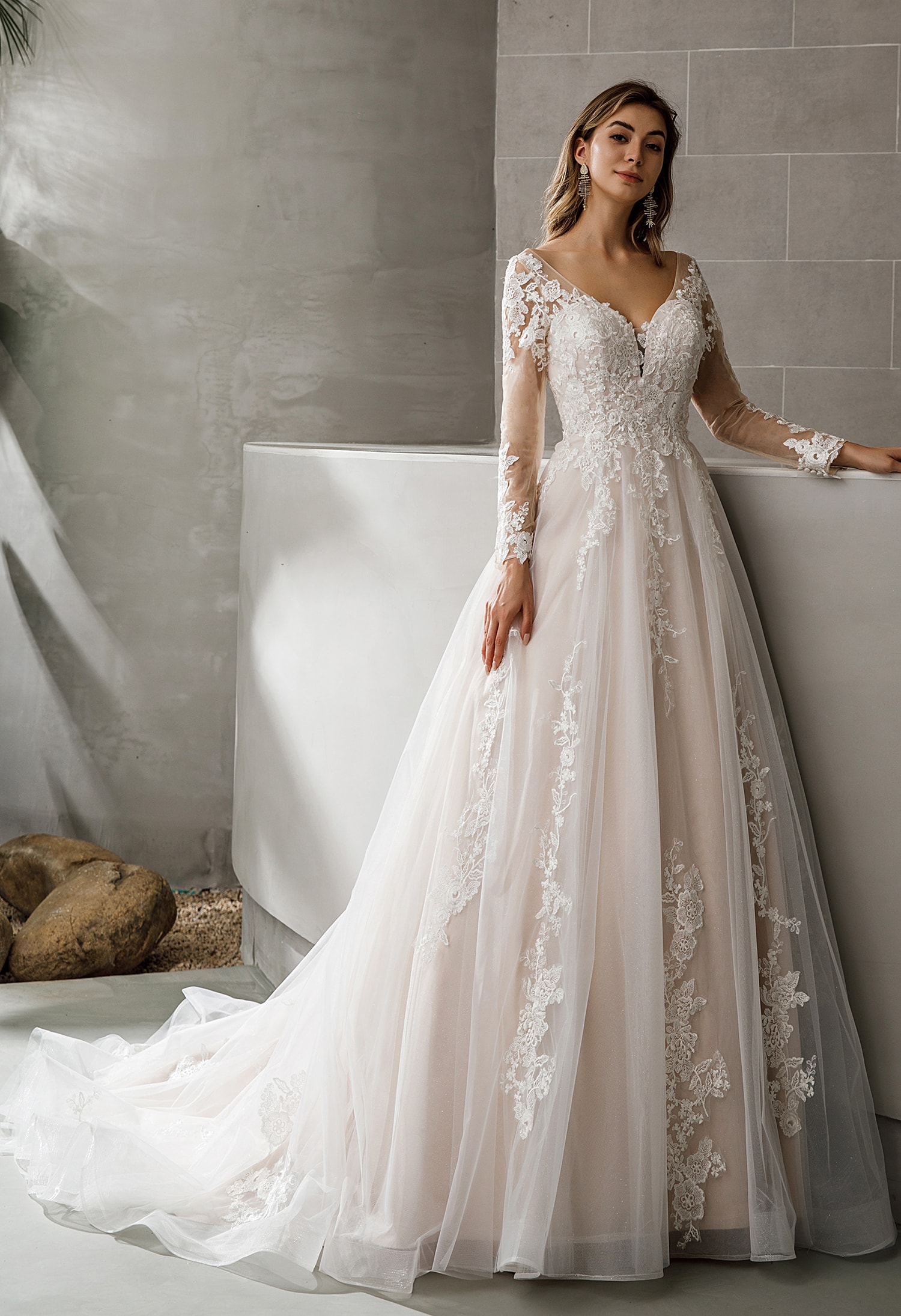 Bride in a beaded crepe fit-and-flare wedding gown
