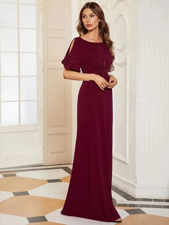 Elegant woman in a blush pink lace formal gown