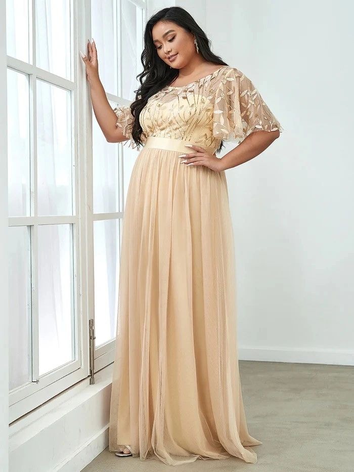 Elegant woman in a burgundy wine formal evening gown