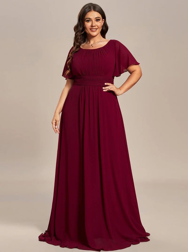 Elegant woman in a champagne gold formal gown